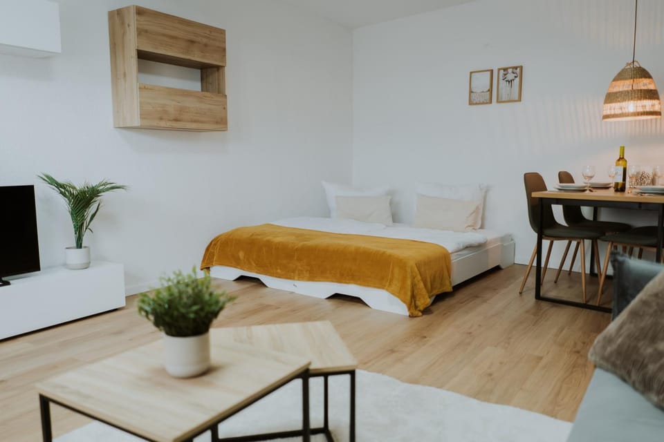 Bed, Living room, Seating area, Dining area