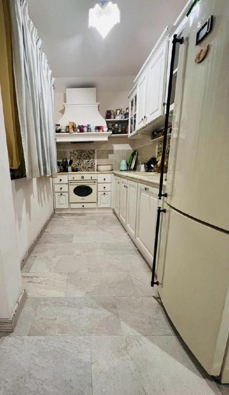 Kitchen or kitchenette, dishwasher, oven, stove
