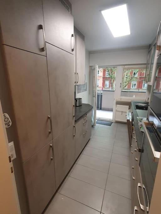 Kitchen or kitchenette, dishwasher, oven, stove