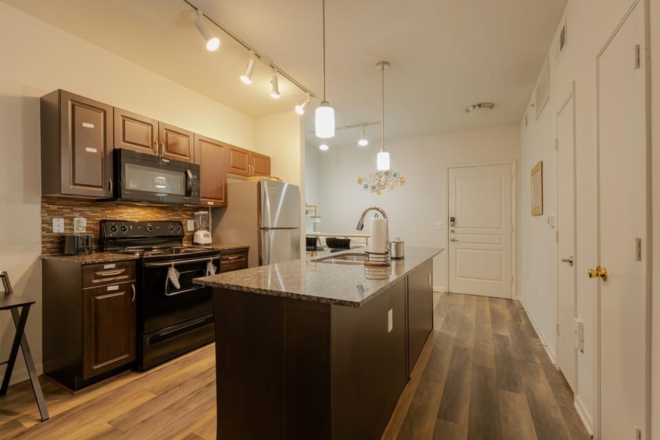 Kitchen or kitchenette, dishwasher, oven, stove, toaster