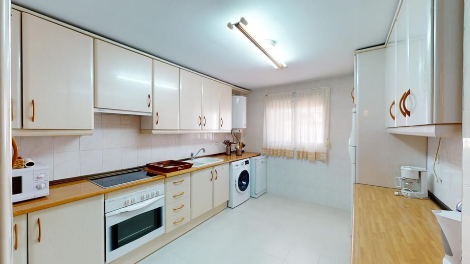 Kitchen or kitchenette, dishwasher, oven, stove, washing machine
