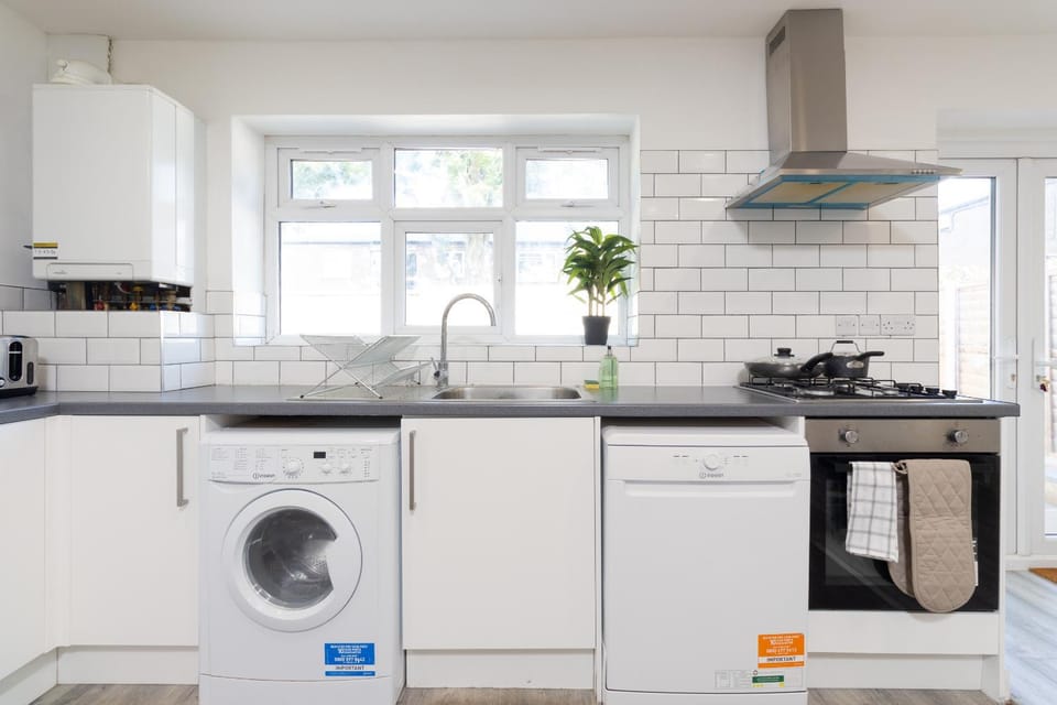 Kitchen or kitchenette, dishwasher, stove, washing machine, dryer