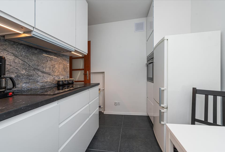 Kitchen or kitchenette, dishwasher, oven, stove