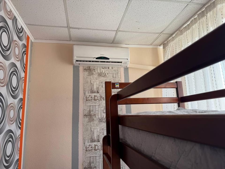 Photo of the whole room, bunk bed, air conditioner
