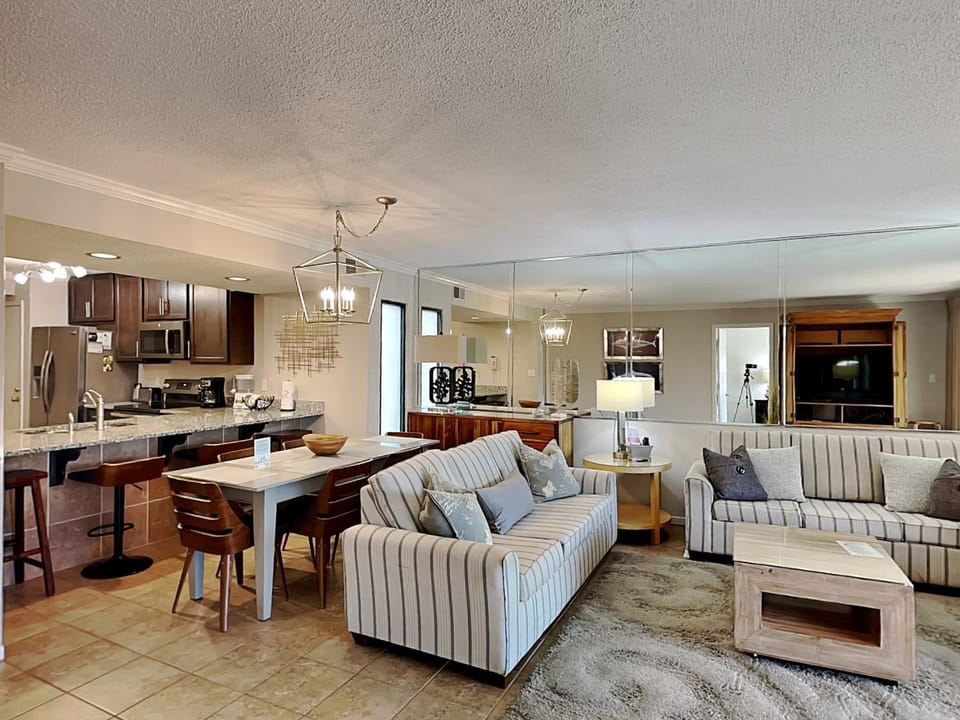 Kitchen or kitchenette, Living room, Dining area, furniture, microwave, stove, air conditioner