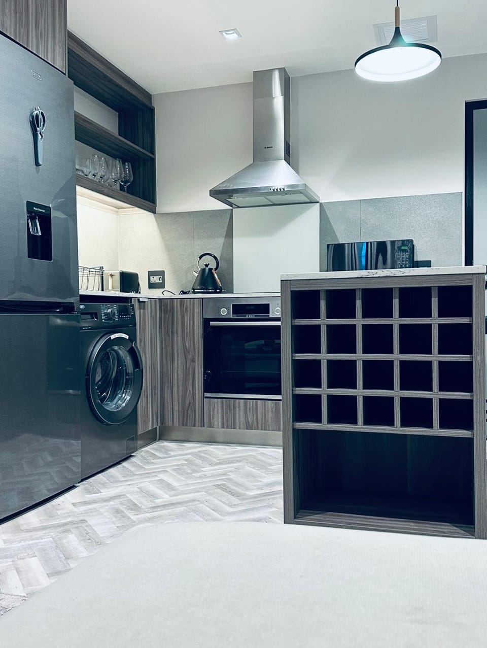 Kitchen or kitchenette, oven, stove, washing machine