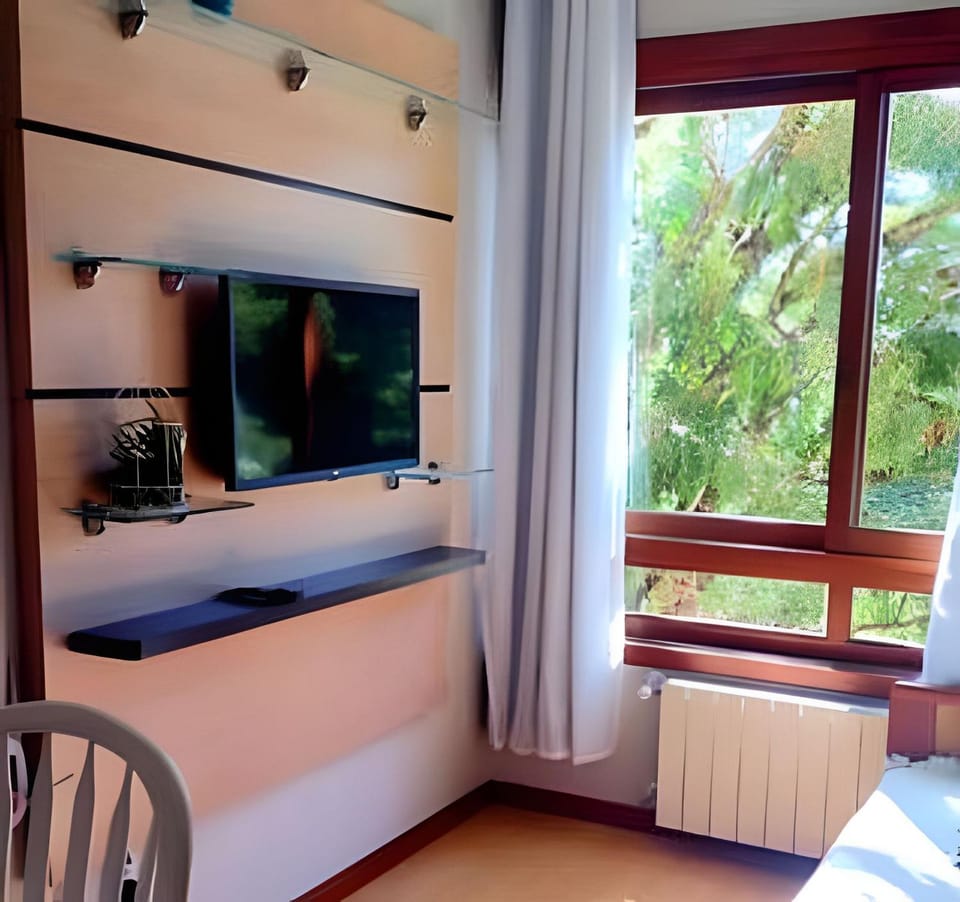 Gramado Apartment on Foot! Air Conditioning, Smart TV, Wi-Fi, Parking. House in Gramado