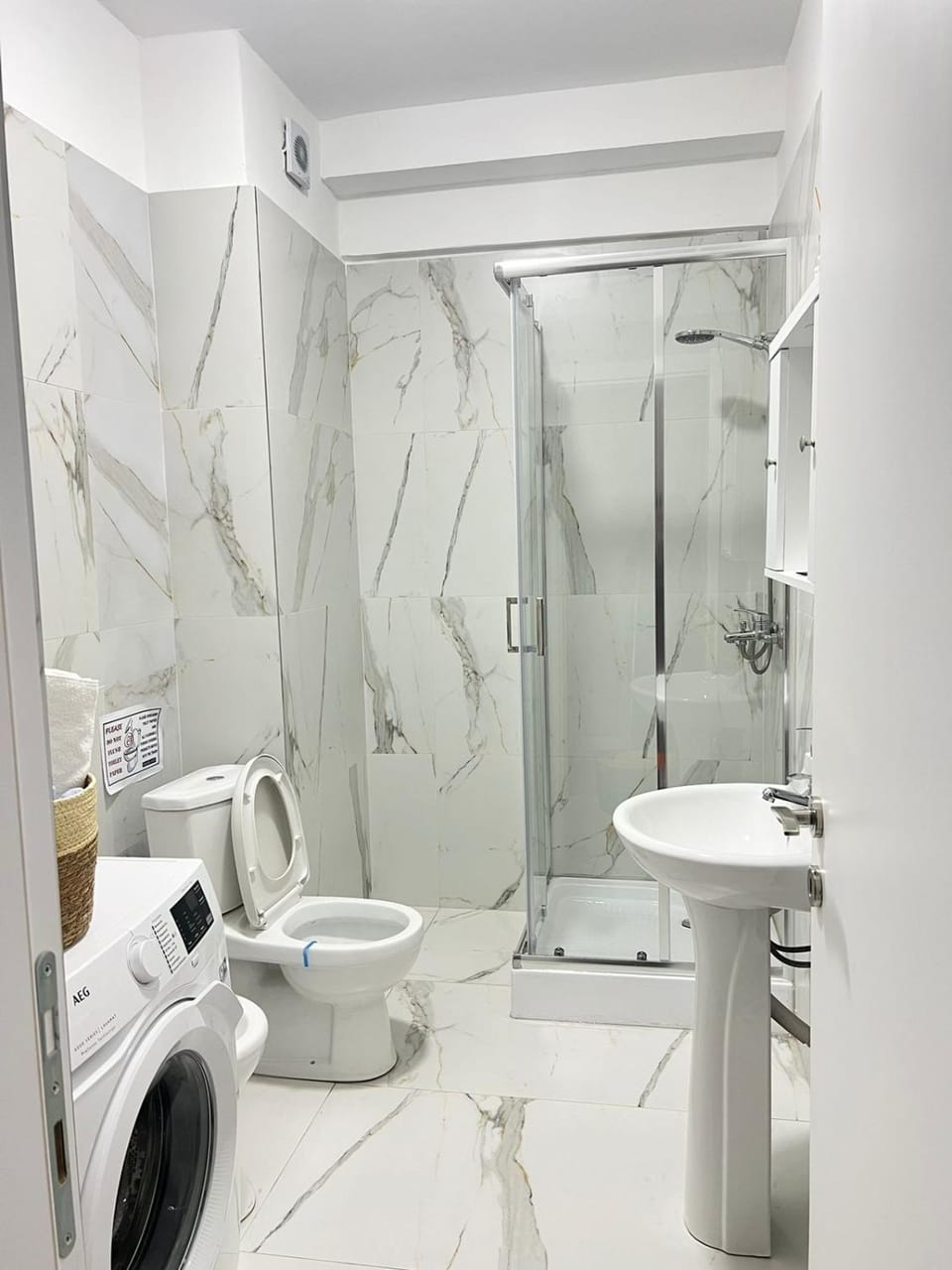 Shower, Toilet, Bathroom, towels, washing machine, dryer