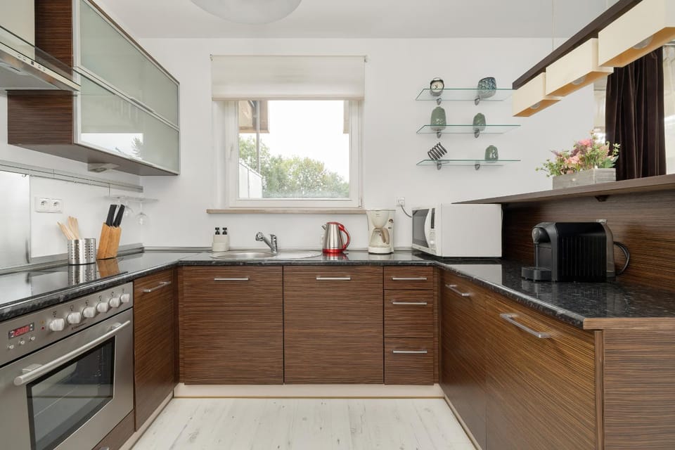 Kitchen or kitchenette, dishwasher, oven, stove
