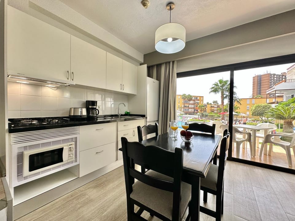 Dining area, stove, toaster, kitchen