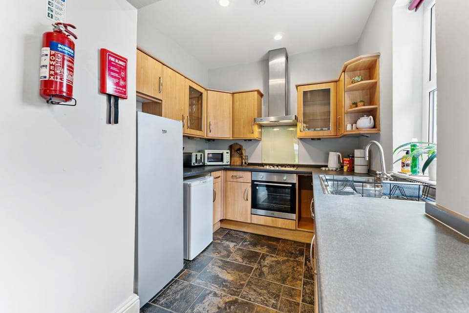 Kitchen or kitchenette, stove, toaster