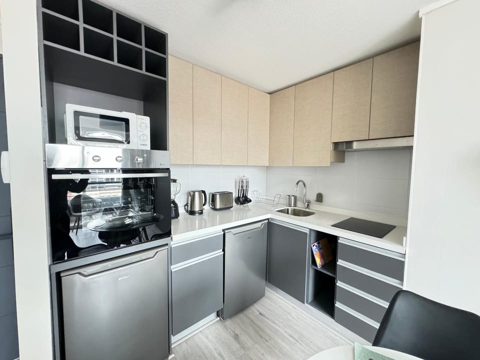 Kitchen or kitchenette, oven, stove, toaster