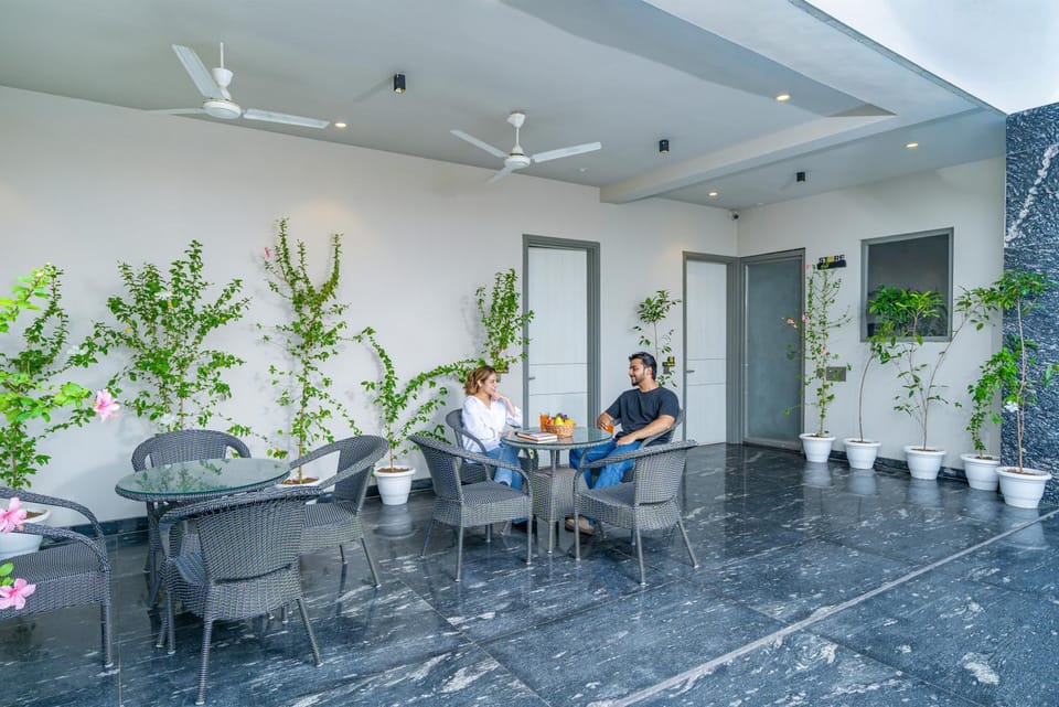 People, Balcony/Terrace, Seating area, Guests, group of guests, sunbed