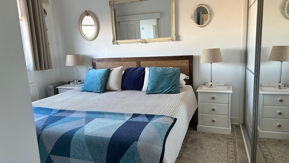 Bed, Bathroom, towels, wardrobe