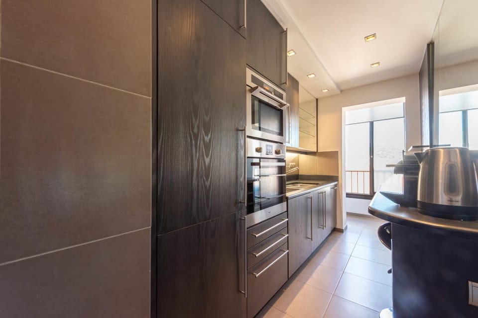 Kitchen or kitchenette, oven, stove