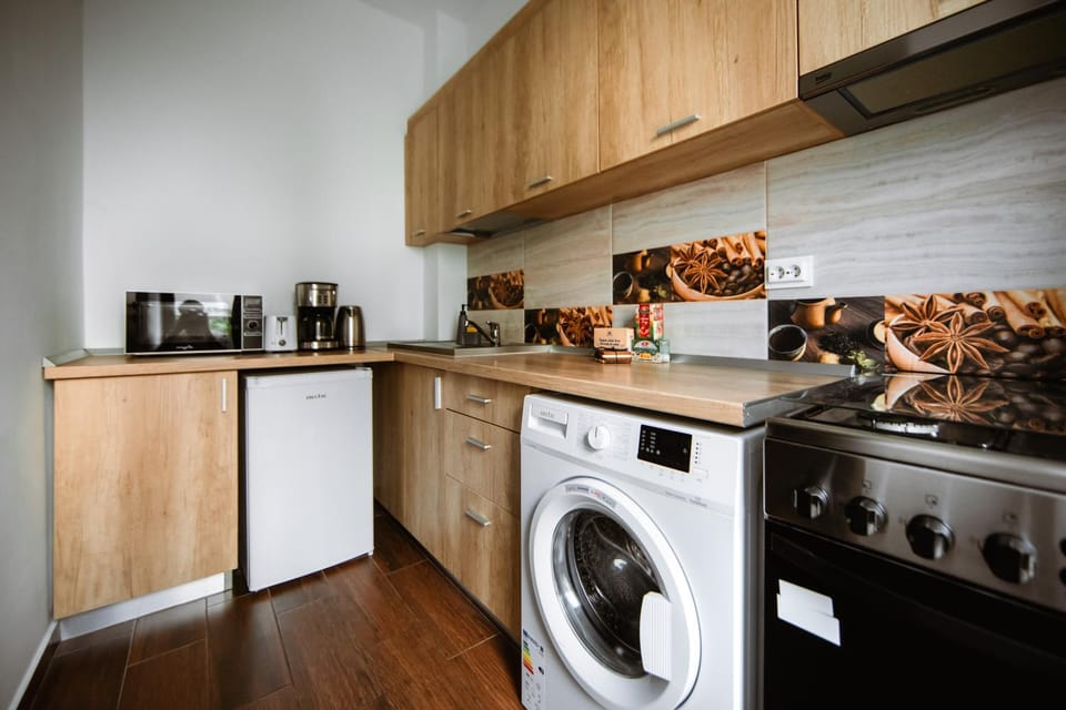 Kitchen or kitchenette, washing machine