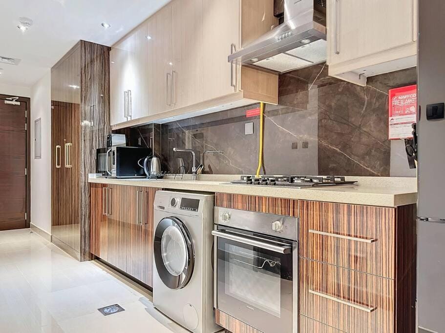 Kitchen or kitchenette, dishwasher, oven, stove