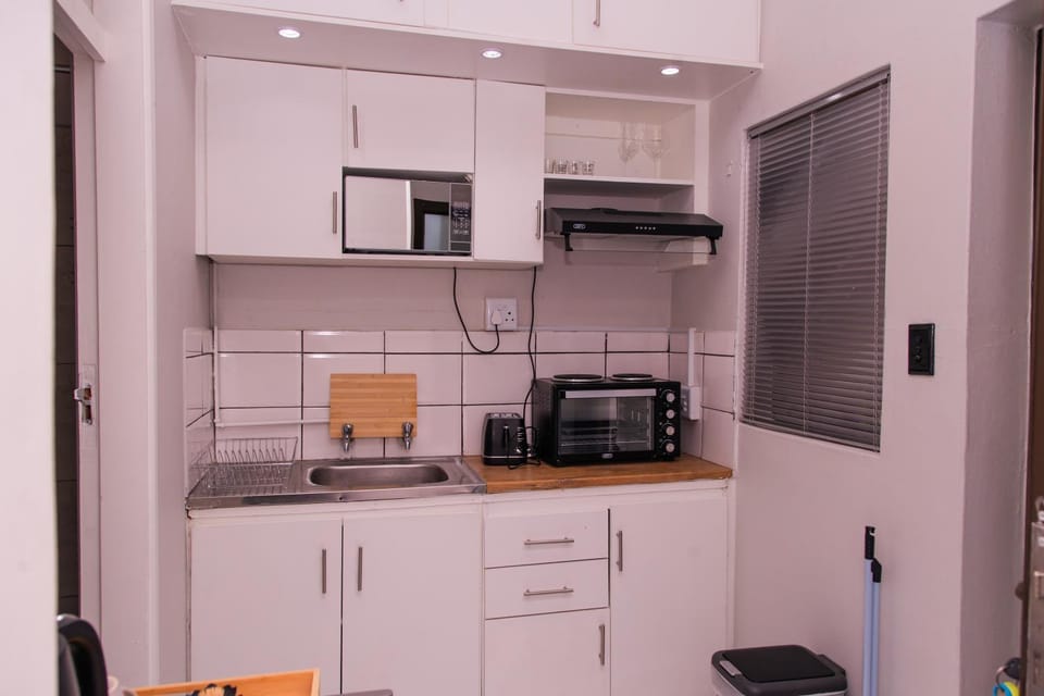 Kitchen or kitchenette, microwave, stove, toaster