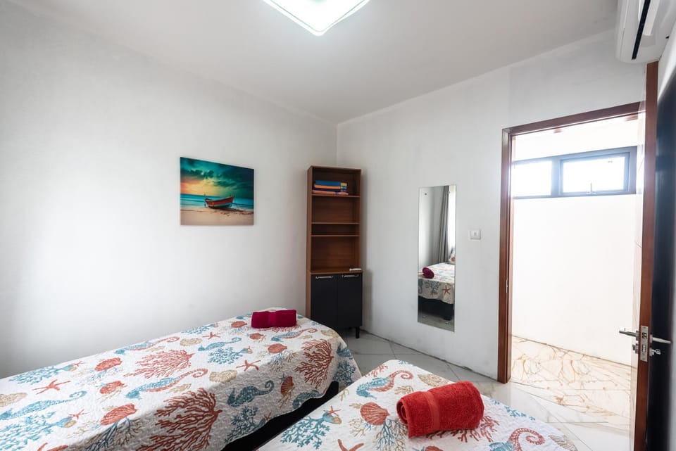 Bed, towels, wardrobe