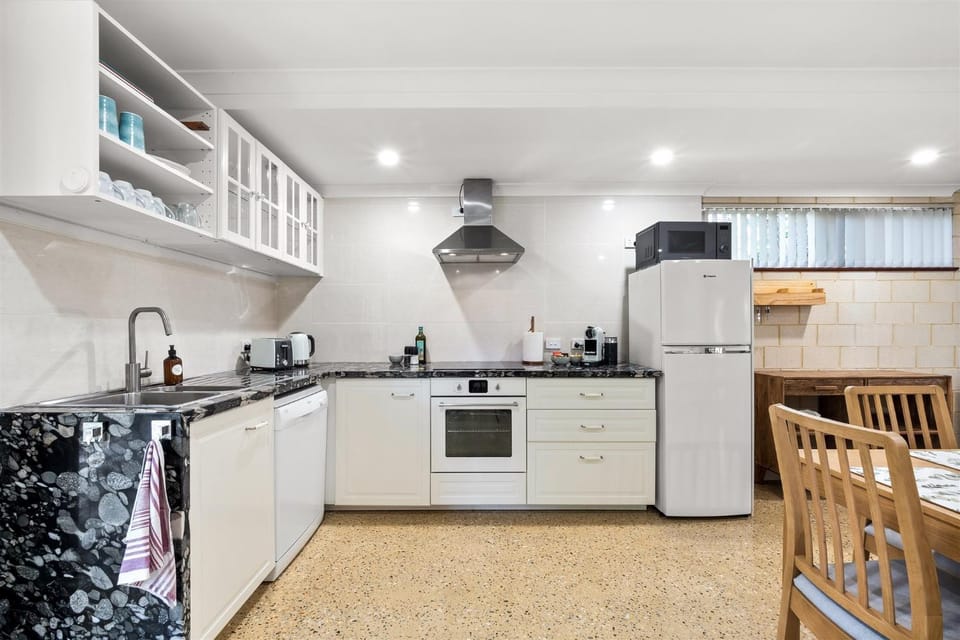 Kitchen or kitchenette, dishwasher, stove, toaster