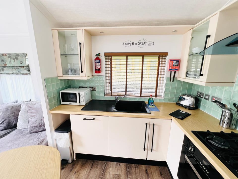 Kitchen or kitchenette, microwave, oven, stove, toaster