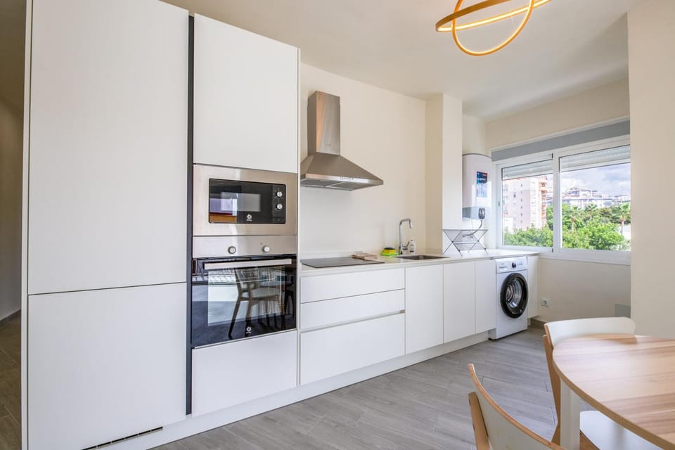 Kitchen or kitchenette, Dining area, oven, stove, toaster, washing machine, dryer