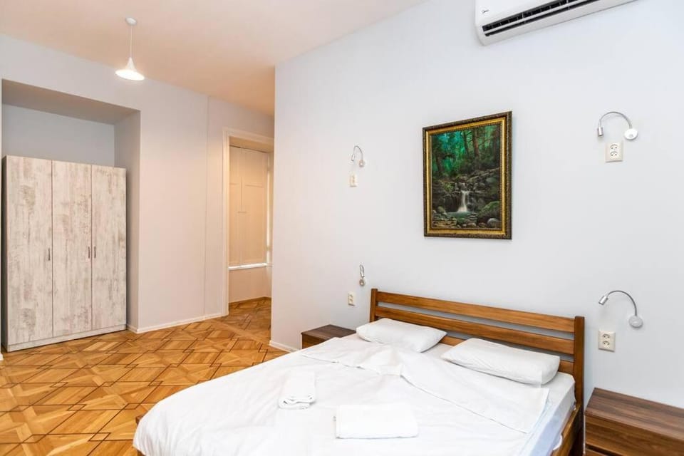 Bed, Bedroom, hair dryier, towels, wardrobe, air conditioner