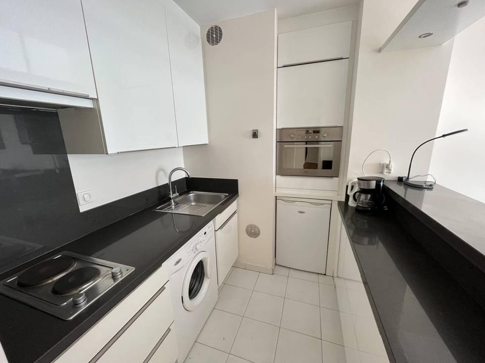 Kitchen or kitchenette, washing machine