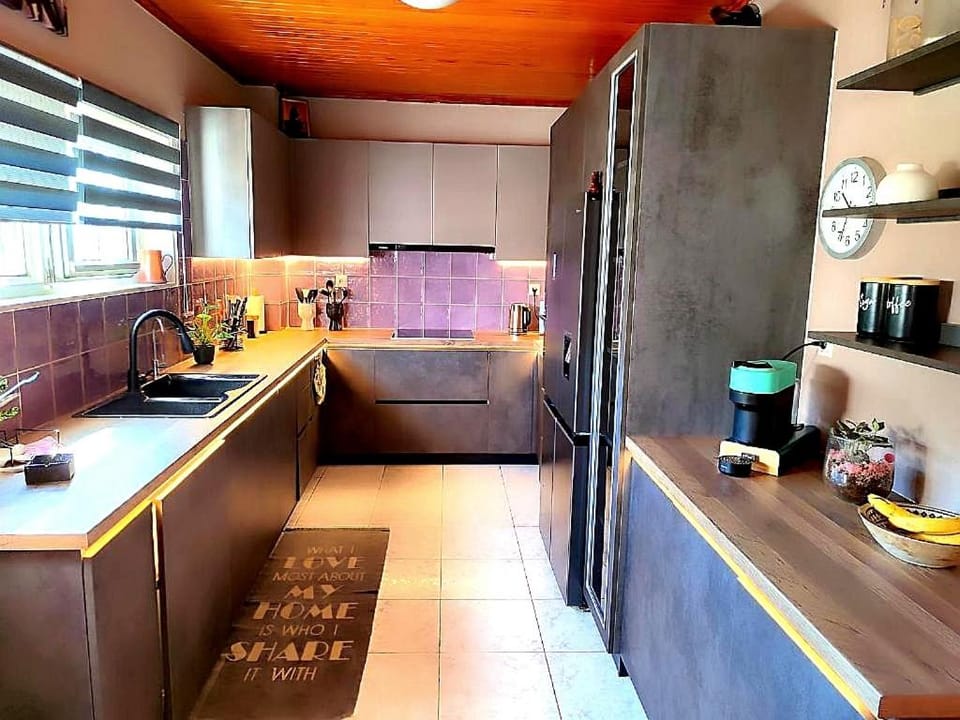 Kitchen or kitchenette, dishwasher, oven, stove