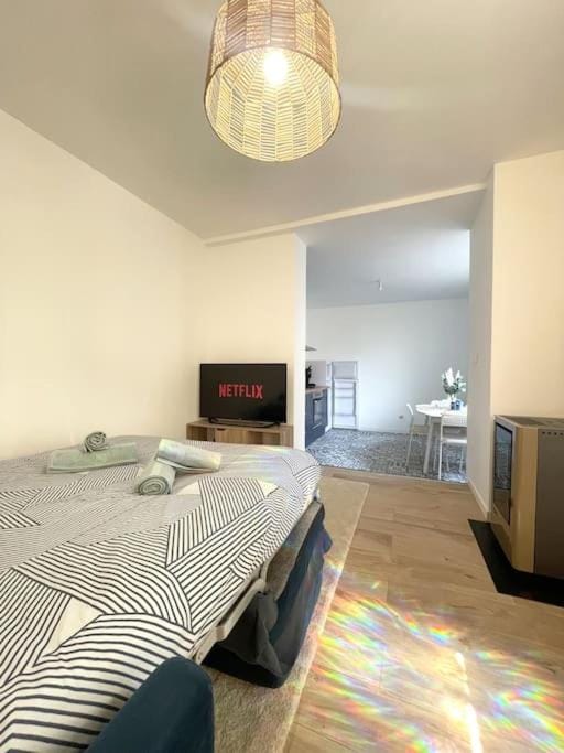 Bed, TV and multimedia, Living room, Seating area, air conditioner
