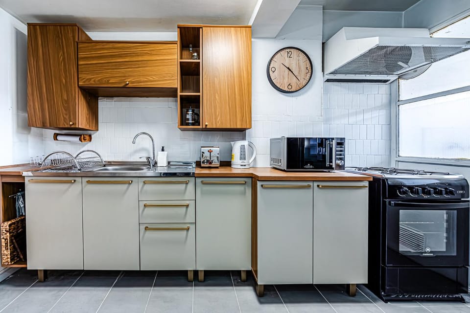 Kitchen or kitchenette, microwave, oven, toaster