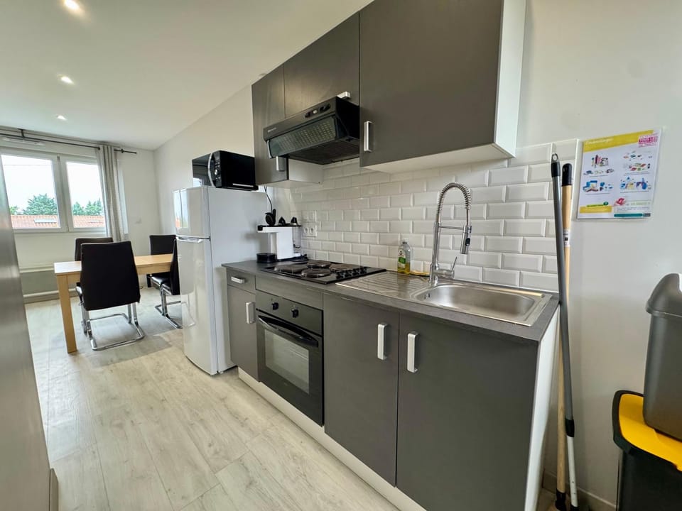 Kitchen or kitchenette, dishwasher, oven, stove