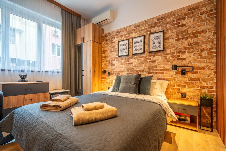 Bed, Seating area, Bedroom, towels, wardrobe, air conditioner
