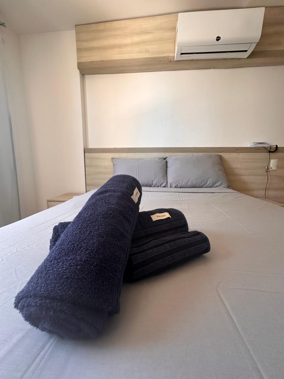 Bed, Photo of the whole room, Bedroom, towels, air conditioner