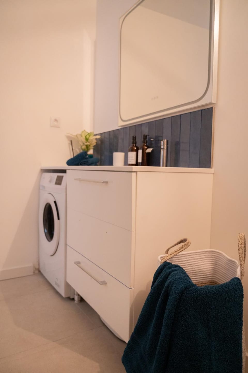 Shower, Toilet, Bathroom, hair dryier, towels, washing machine