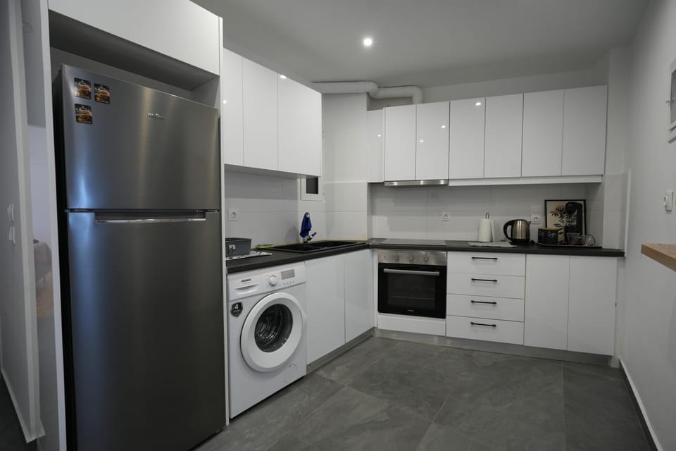 Kitchen or kitchenette, stove, washing machine