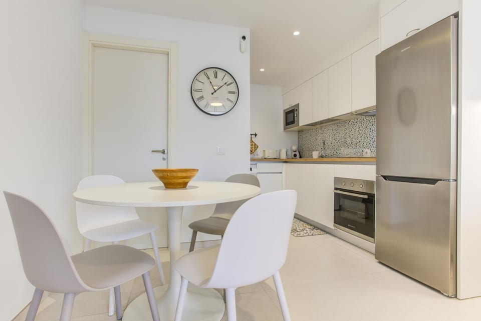 Kitchen or kitchenette, dishwasher, oven, stove