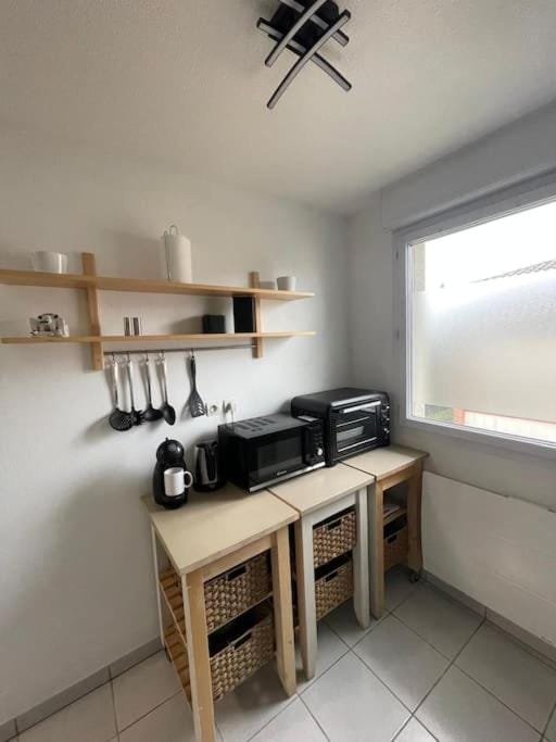 Kitchen or kitchenette, stove, toaster