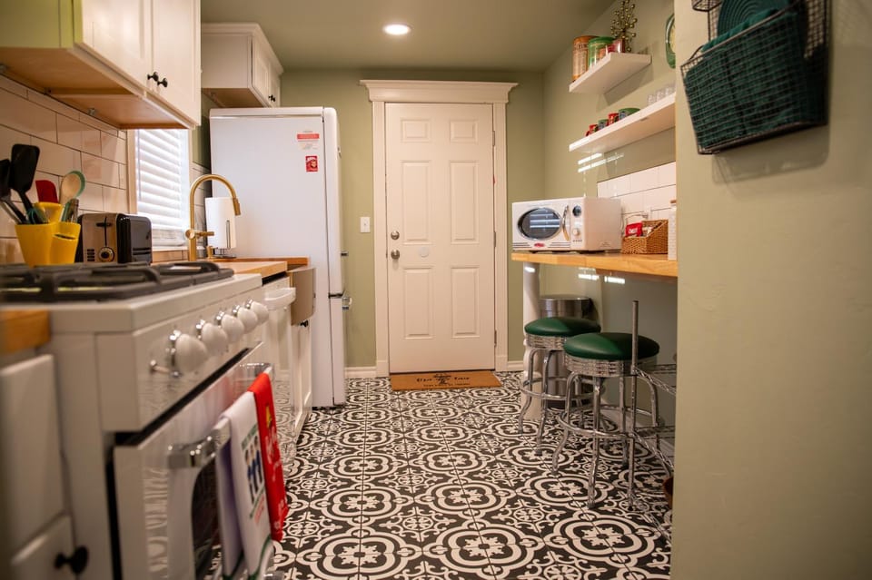 Kitchen or kitchenette, dishwasher, oven, stove