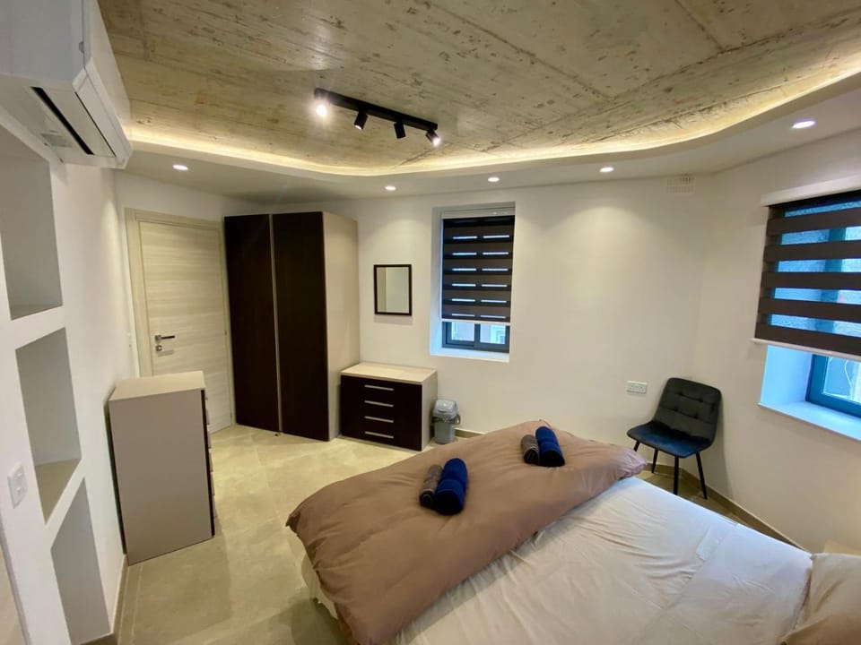 Bedroom, towels, wardrobe, air conditioner