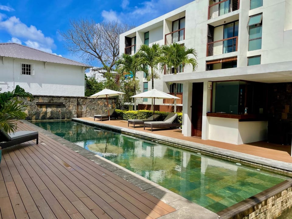 Property building, Swimming pool, Swimming pool, sunbed