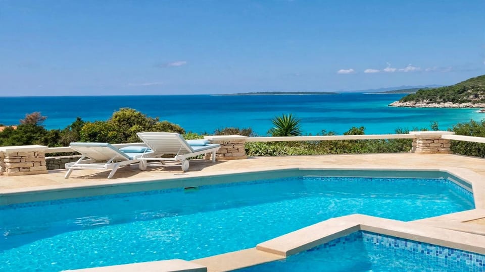 Property building, Patio, Day, Natural landscape, View (from property/room), Beach, Pool view, Sea view, Swimming pool, sunbed