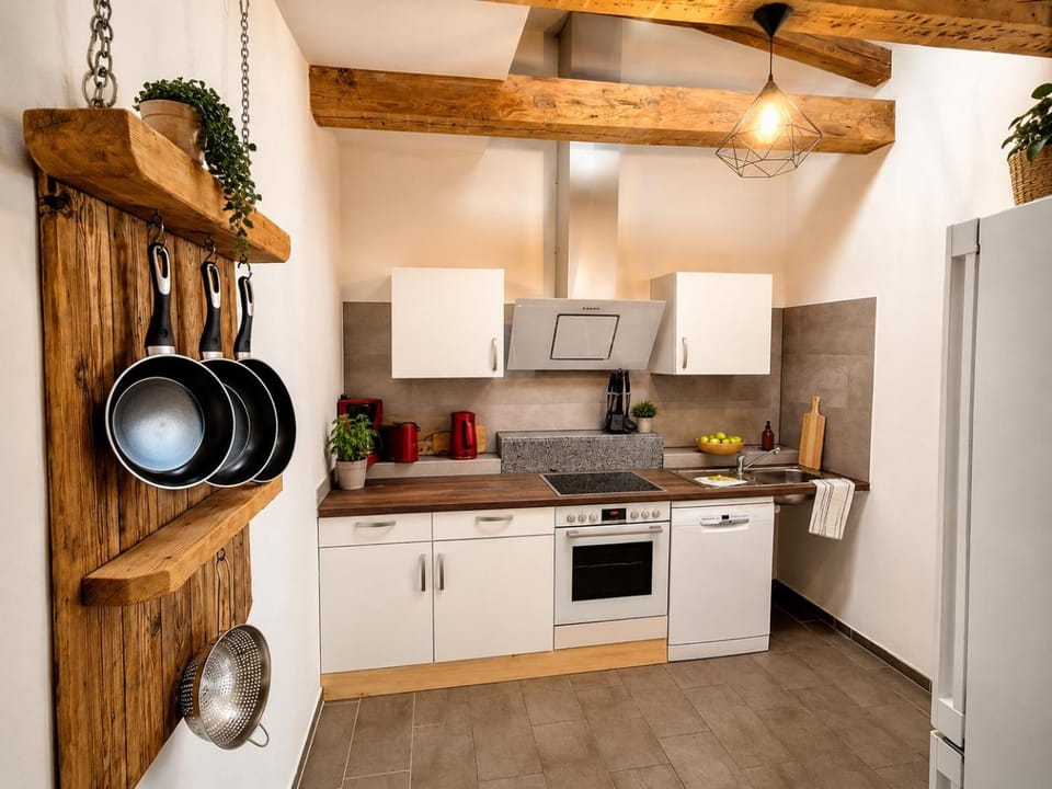 Kitchen or kitchenette, dishwasher, oven, stove, toaster