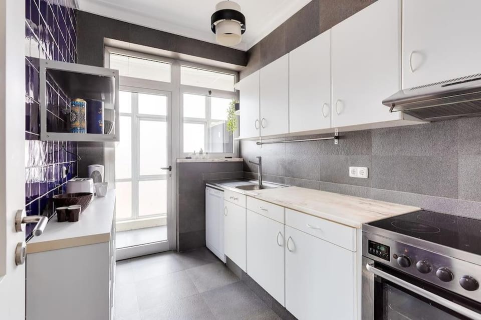 Kitchen or kitchenette, dishwasher, oven, stove, toaster