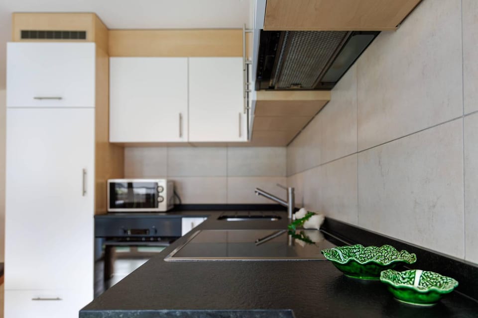 Kitchen or kitchenette, microwave, oven, stove