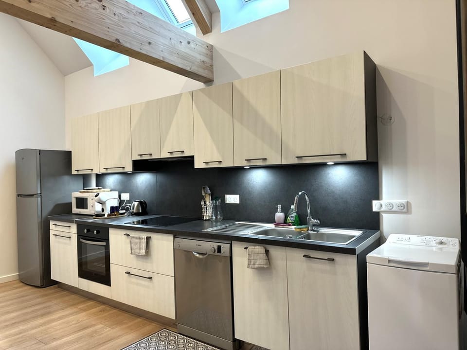 Kitchen or kitchenette, dishwasher, oven, stove