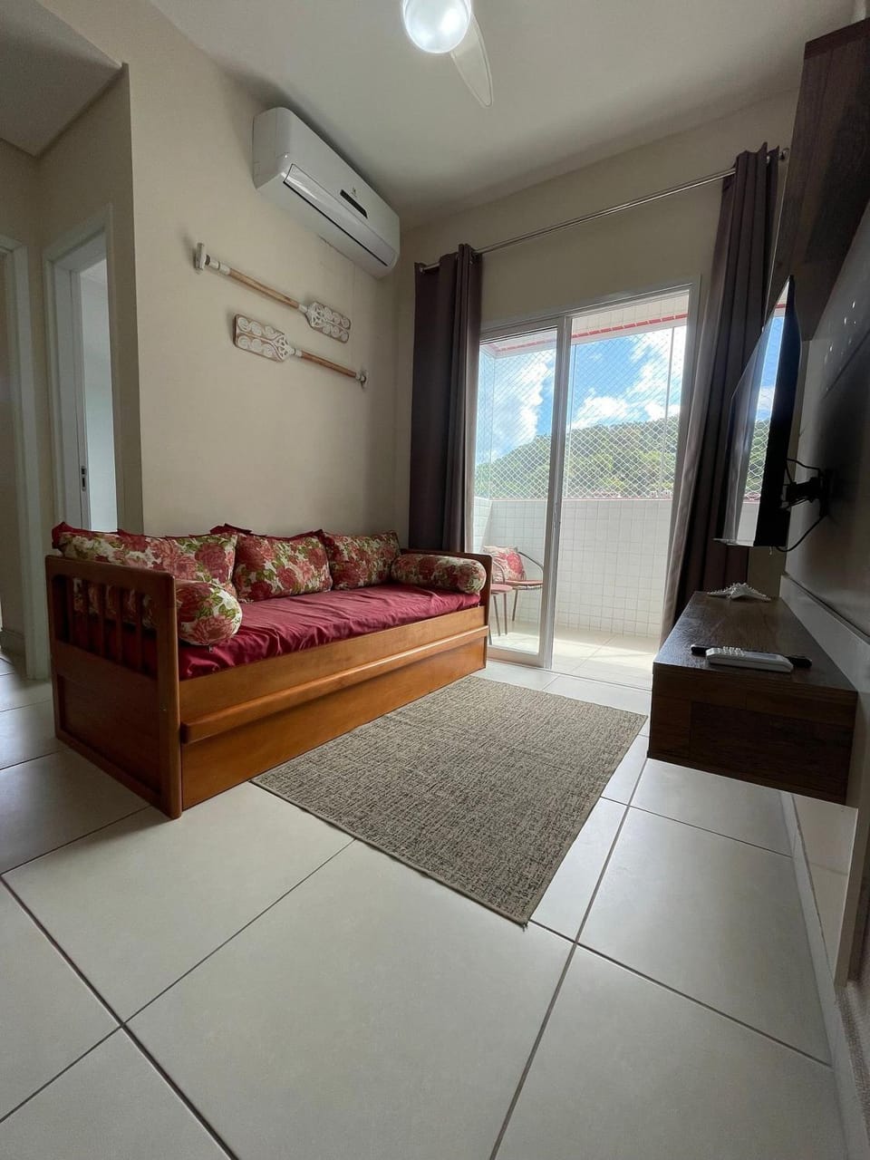 Bed, TV and multimedia, Living room, Seating area, air conditioner