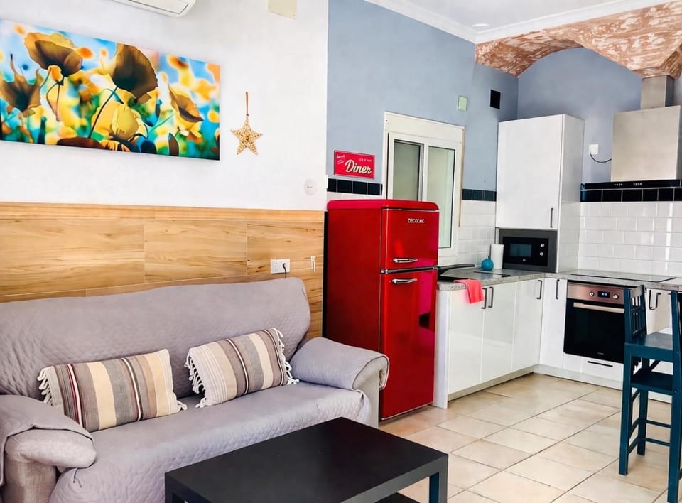 Kitchen or kitchenette, Living room, Seating area, Dining area, oven, stove, toaster, air conditioner