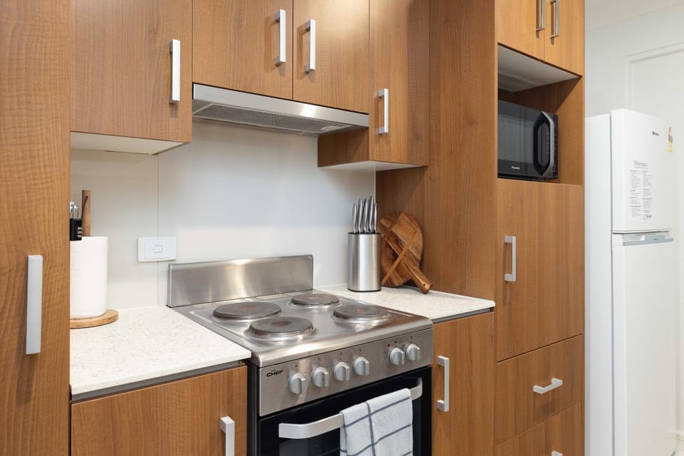 Kitchen or kitchenette, dishwasher, oven, stove, toaster