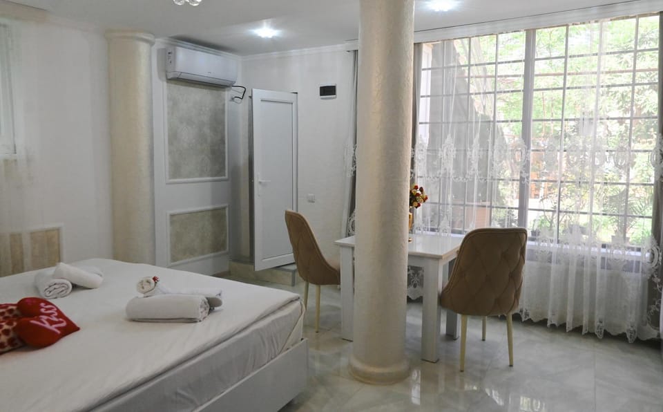 Bed, Photo of the whole room, Seating area, Bedroom, towels, wardrobe, air conditioner